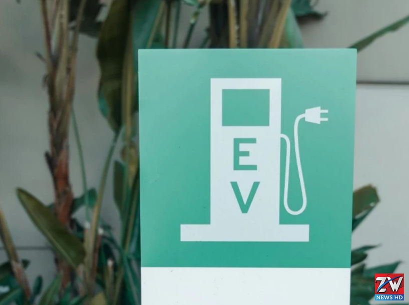 People debate electric vehicle regulations during a heated discussion about future transport policies and environmental rules.