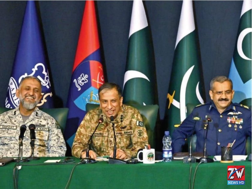 Military officials standing alert and prepared to respond swiftly to any potential attack during a security briefing.