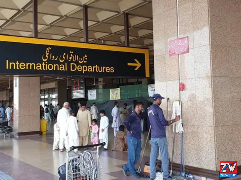 Passengers and airport staff dealing with delays and confusion during baggage unloading operations at a busy airport terminal.