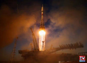 A Russian Soyuz spacecraft carrying one American astronaut and two Russian cosmonauts lifts off toward the International Space Station as NASA's chief attends the launch.