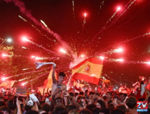 Spain's players celebrate together after winning the FIFA World Cup for the second time, lifting the trophy with joy and pride.