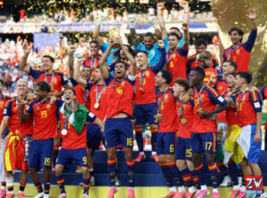 Spain celebrates after defeating Argentina 1-0 to win the 2026 FIFA World Cup final, with players lifting the trophy during the championship ceremony.